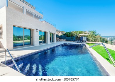 Luxury Modern House With Swimming Pool With Waterfall Jet. House Marble