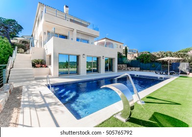 Luxury Modern House With Swimming Pool With Waterfall Jet. House Marble