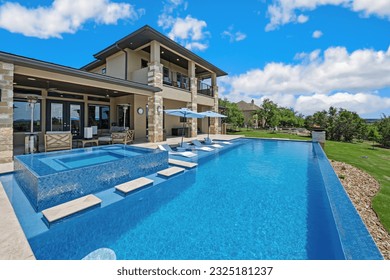 a luxury modern pool with an infinity edge - Powered by Shutterstock