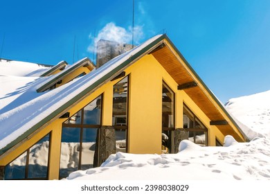 Luxury modern vip hotel,house,mansion covered in snow in winter mountains,nature. Calm countryside. Home residence,real estate,ski alpine resort. Vacation,travel concept.