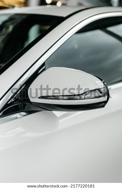 luxury new car year side mirror with 3d\
camera view on parking. High quality\
photo