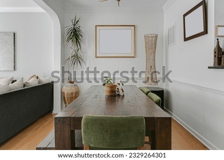 Luxury Organic Sustainable Mid Century Modern Dining Room with Wood Accents Brass Pendant Light Fixture and Plants Mockup