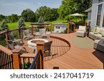 Luxury Outdoor Deck with Fire Pit Seating and Rattan Lounge Area