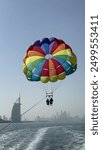 Luxury Parasailing experience, couple enjoy parasailing view, Summer activity on beaches, Dubai parasail, speed boat with parasailing, happy couple on vacation