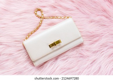 Luxury Pink Clutch Bag On A Fur Pink Background.