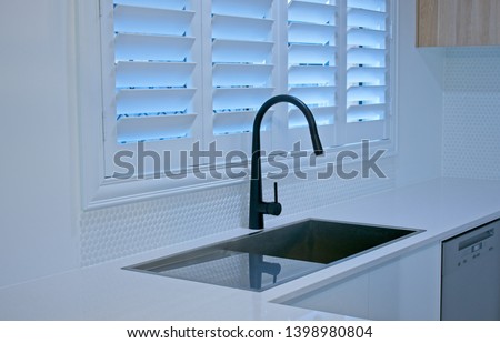 Luxury plantation shutters in a modern kitchen