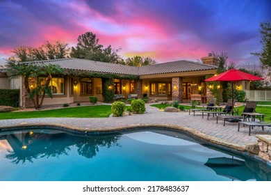 a luxury pool at sunset - Shutterstock ID 2178483637