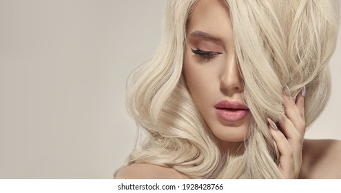 Luxury Portrait Of Sexy European Ethnicity Woman With Amazing Blonde Color Hair On A Beige Background, Close Up Picture With Free Copy Space For Text.