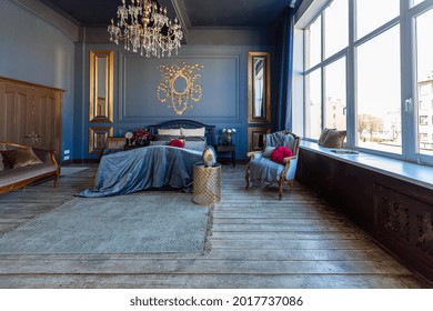 Luxury Posh Bed Room Interior In
Deep Blue Color With Antique Expensive Furniture And Gold Elements In Baroque Style