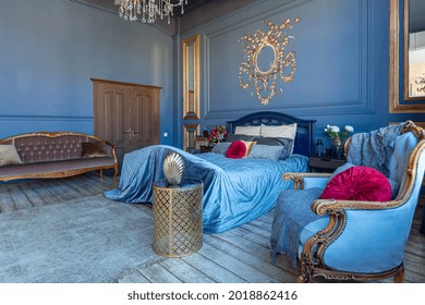 Luxury Posh Bed Room Interior In
Deep Blue Color With Antique Expensive Furniture And Gold Elements In Baroque Style