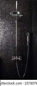 Luxury Rain Shower In Domestic Bathroom Against Italian Glass Mosaics.