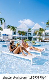 Luxury Resort With Swimming Pool Near Palm Beach Aruba Caribbean, Couple Man And Woman Mid Age On A Luxury Vacation In The Caribbean