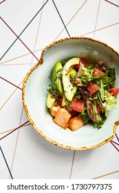 Luxury Restaurant Side Dish Top View. Salad With Salmon And Avocado. Fish And Vegetable Mix. Entree Addition. Delicious Meal Course In Deep Craft Plate. Fancy Gourmet Food Overhead Shot