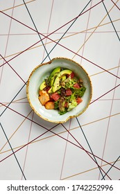 Luxury Restaurant Side Dish Top View. Salad With Salmon And Avocado. Fish And Vegetable Mix. Entree Addition. Delicious Meal Course In Deep Craft Plate. Fancy Gourmet Food Overhead Shot