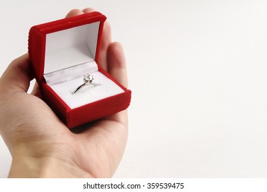 Luxury Ring With Diamond In Stylish Red Box In Hand On White Background, Present And Love Concept, Valentine's Day Proposal