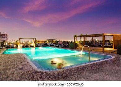 Luxury Rooftop Swimming Pool At Sunset, Blurred Motion