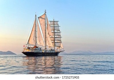 Luxury Sailing Yacht At Sunset In The Sea