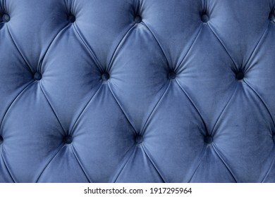 luxury seamless background of velvet blue fabric on upholstered furniture