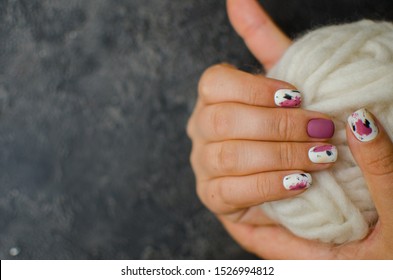 Luxury Short Manicure On A Dark Wooden Background. Cozy Autumn Nails.