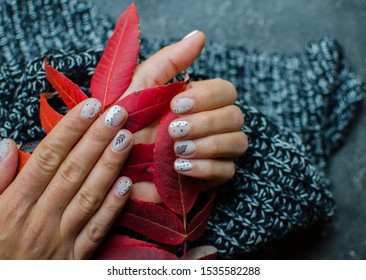 Luxury short manicure dark wooden background  cozy winter nails