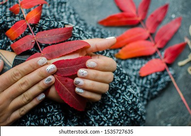 Luxury short manicure dark wooden background  cozy winter nails