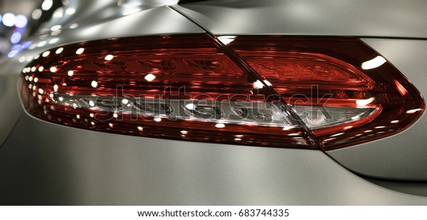 Luxury sport car. Back\
body reflections. The back view of a sport car. Modern Sport Car\
exterior details.