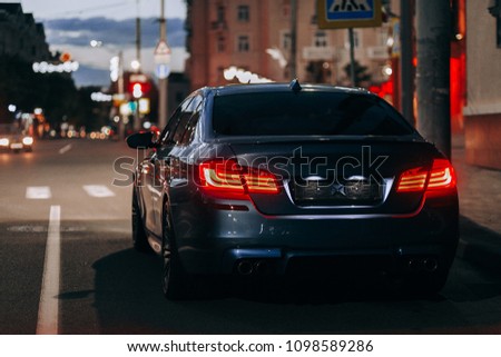 Luxury sport car night view on city street	
