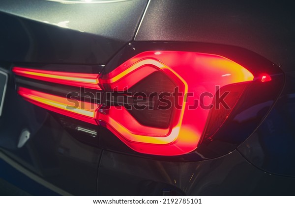 Luxury sports car brake\
lights.
