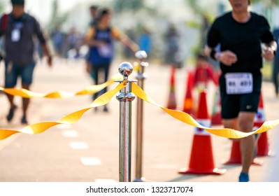 Luxury Stainless Barricade With Yellow Rope Ribbon On The Road In Marathon Event At The Finish Point. 