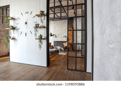 Luxury Studio Apartment With A Free Layout In A Loft Style In Dark Colors. Stylish Modern Kitchen Area With An Island, Cozy Bedroom Area With Fireplace And Personal Gym