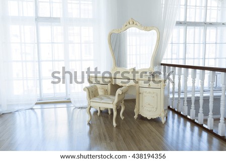 Luxury stylish bright light interior of apartment. White walls decorated by ornament. Nobody inside room. bedroom.