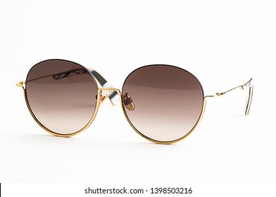 Luxury Sunglasses Isolated On White Background. With Clipping Path For Artwork Or Design. Light Brown.