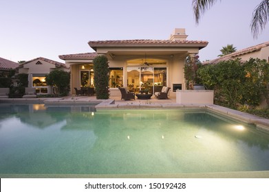 Luxury Swimming Pool And House Exterior Against Clear Sky