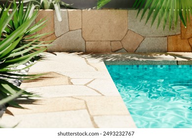 Luxury swimming pool with tropical plants and stone path. Poolside patio in mediterranean holiday villa. - Powered by Shutterstock