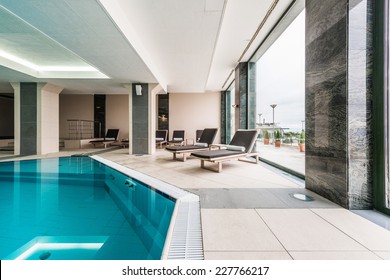 Luxury swimming pools in a modern hotel - Shutterstock ID 227766217