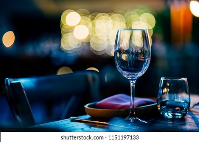 Luxury table settings for fine dining with and glassware, beautiful blurred  background. For events, weddings.  Preparation for holiday  Christmas and Hanukkah dinner night. props for weddings, birthd