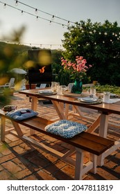 Luxury Tableware Set On Dining Table In The Backyard. Everything Is Prepared For Family Gathering