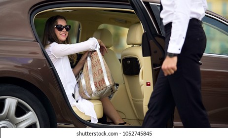 Luxury Taxi Service, Chauffeur Opening Car Door For Female Passenger, Travel