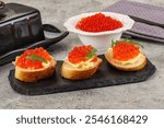 Luxury toast with red caviar and butter