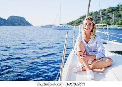 Luxury Travel On The Yacht. Young Happy Woman On Boat Deck Sailing The Sea. Yachting In Greece.