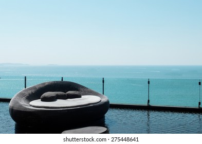 Luxury Used Sofa Bed With Soft Pillow As Interior Furniture With Blue Sea And Clear Sky As Copyspace At The Luxury Hotel Lounge On The Outdoor Balcony For Outside Meeting Party With Scenery Background