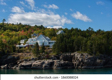 Luxury Vacation Summer Home With Ocean View Photoed During The Day Time In Autumn. Generic Large Expensive Real Estate Mansion Along The Sea Coast