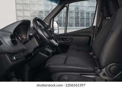 Luxury van driver seats with dashboard, multimedia control screen, and steering wheel. The cockpit of a modern luxury minivan. Delivery van interior with comfortable seats - Shutterstock ID 2206561397