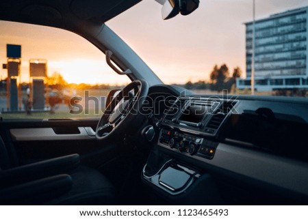 Luxury van driver seats with dashboard, multimedia control screen and steering wheel