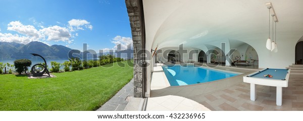 Luxury\
villa with indoor swimming pool, green\
garden