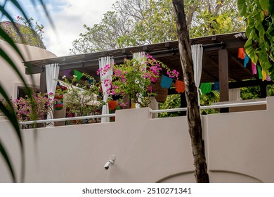 A luxury villa with a large pool, outdoor living spaces, and tropical landscaping. - Powered by Shutterstock