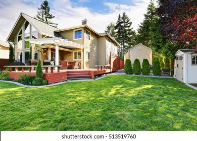 Luxury Waterfront House Exterior With Well Kept Lawn, And Small Shed In The Back Yard. Lake Tapps, Washington, Northwest, USA