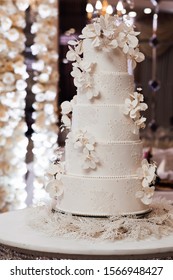 Luxury Wedding Cake On Restaurant Interior Background. Beautiful Wedding Cake, White Cake Wedding Decoration