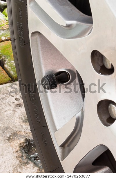 Luxury\
white car tire pressure monitoring sensor\
system