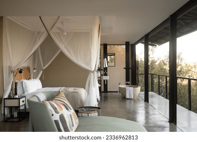 The luxury in the wilderness in a safari lodge hotel room, with spacious interior and breathtaking open views of Kruger Park. 
